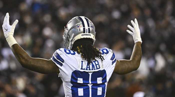 CeeDee Lamb puts his arms up.